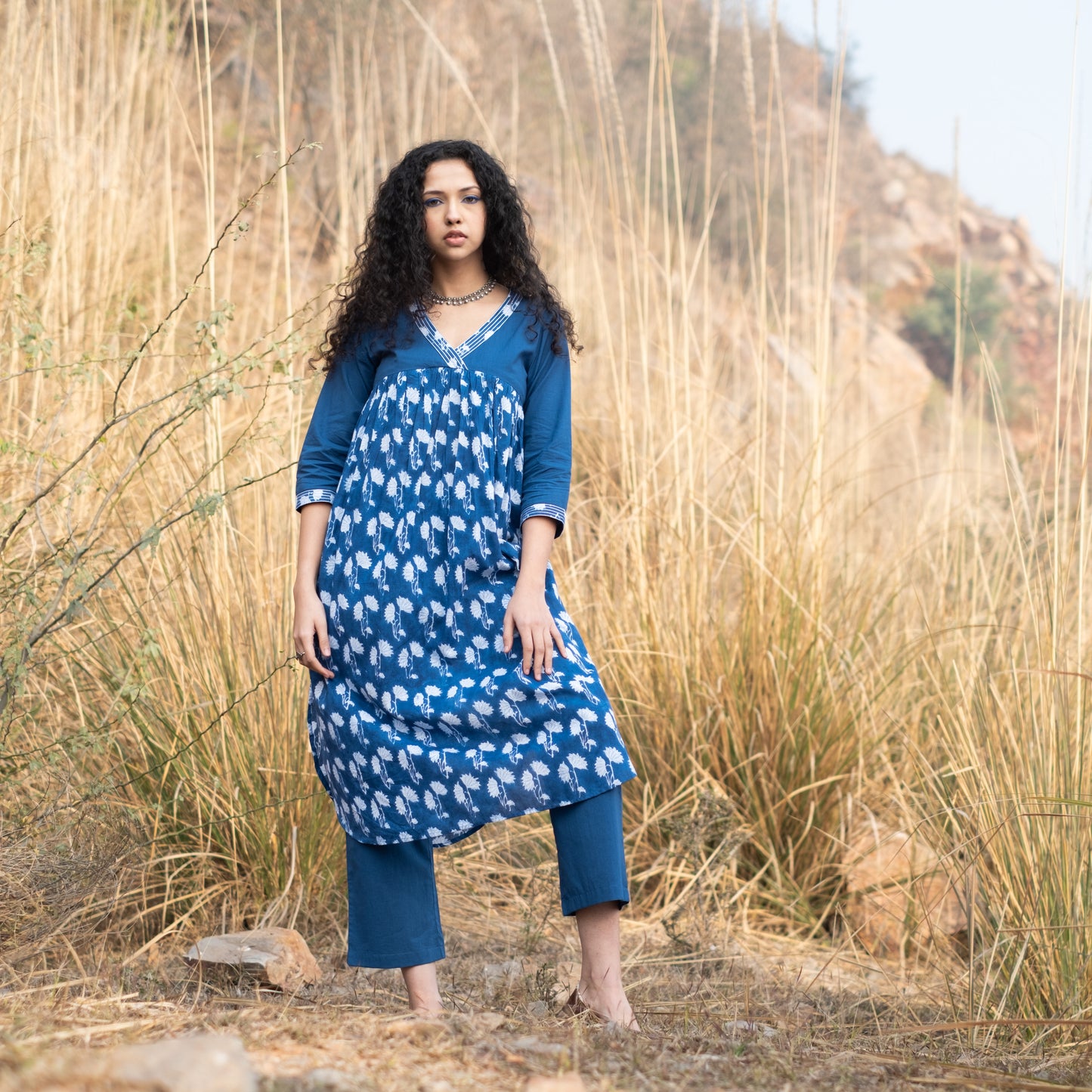 Indigo block printed gathered kurta with V Neck embroidered neckline and solid indigo pants (set of 2)