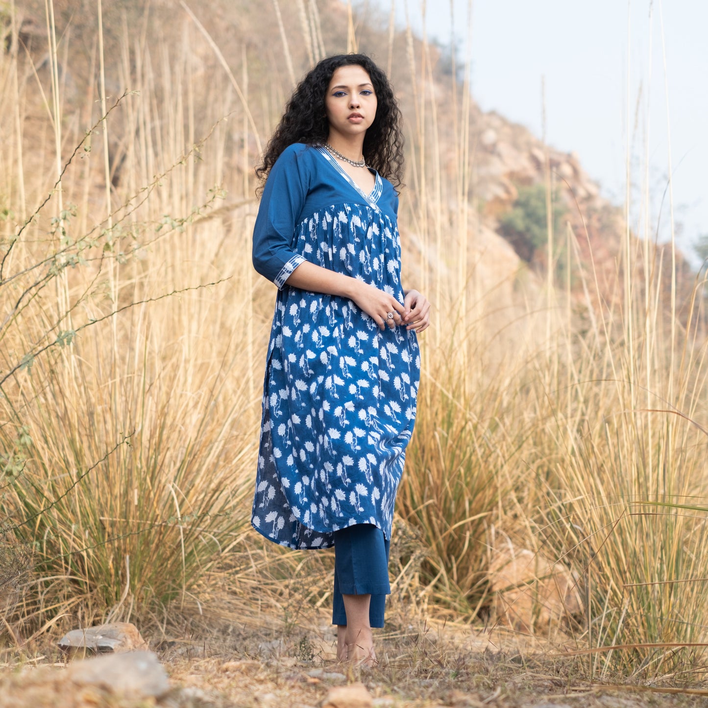 Indigo block printed gathered kurta with V Neck embroidered neckline and solid indigo pants (set of 2)